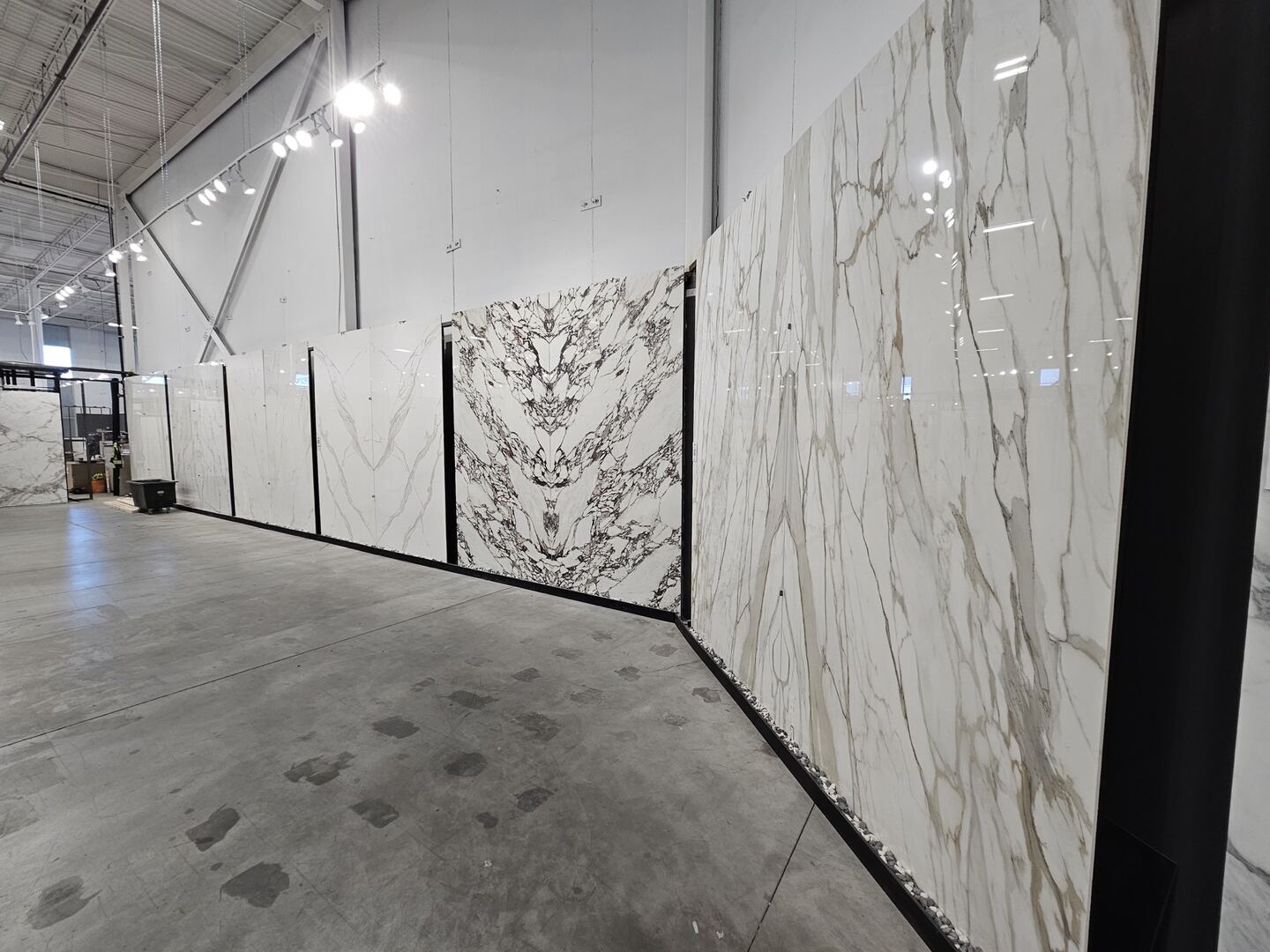 Large stone panels and samples displayed in the showroom